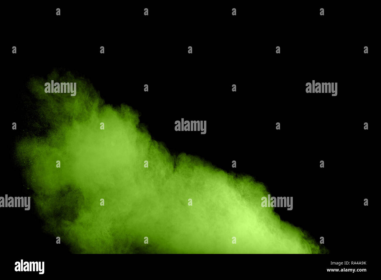 abstract green dust explosion on black background.abstract green powder
