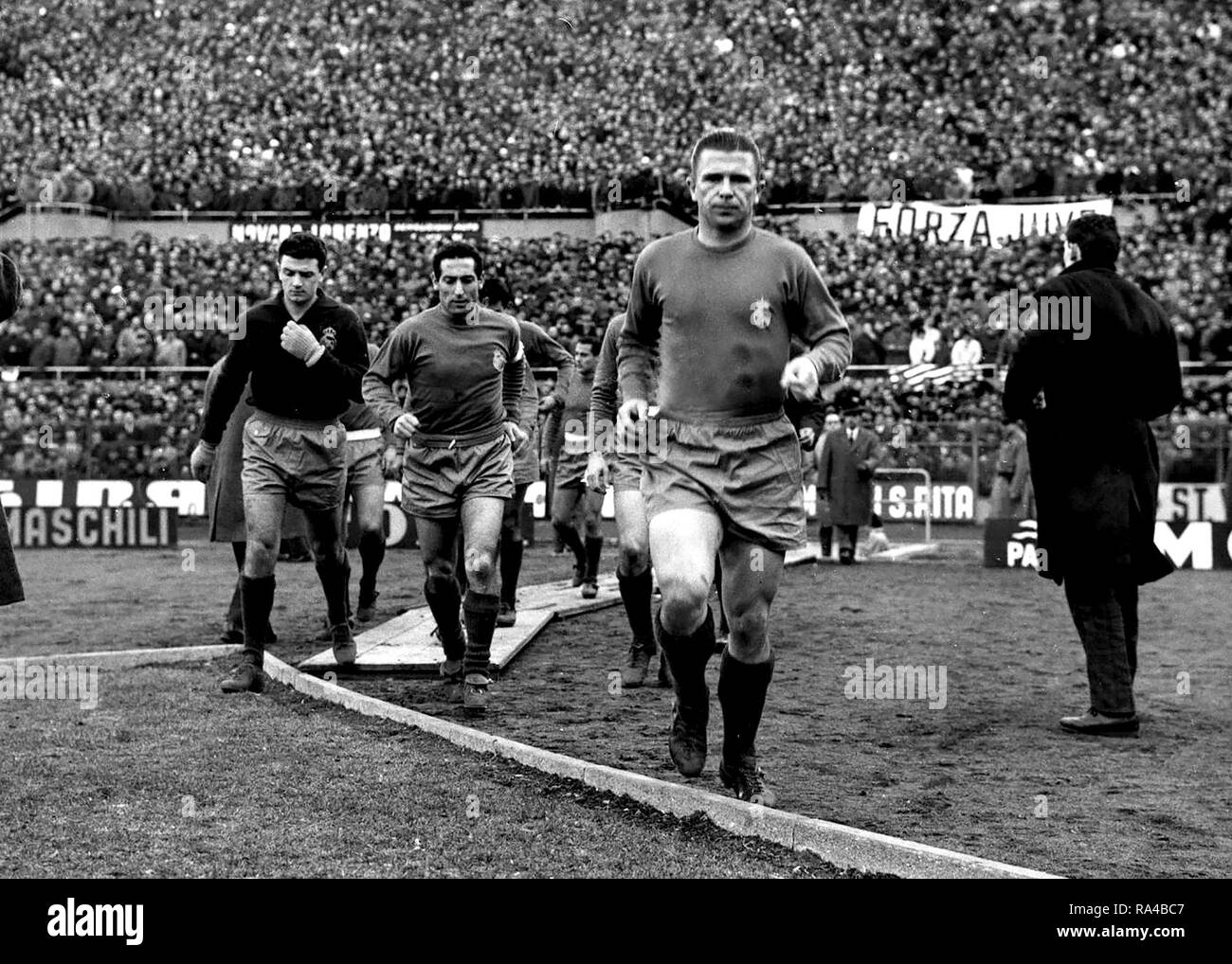 From left to right: Real Madrid C.F.'s footballers José Araquistáinin, Francisco Gento and Ferenc Puskás come back to the field for the 2nd half of their victorius away match versus Juventus F.C. (0-1), 1st leg of the 1961–62 European Cup quarter-finals. Stock Photo
