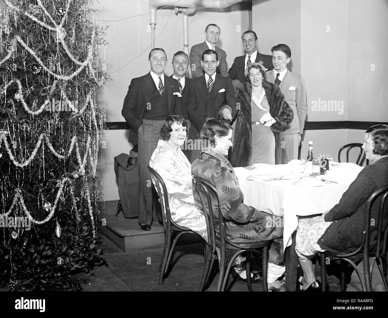 Group of people at a Chsitmas party or Christmas dinner (USA) in 1930 Stock Photo