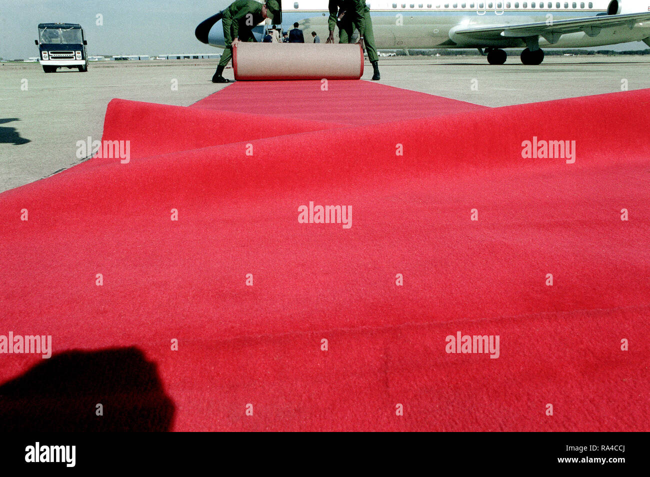 1980 - Airmen place a red carpet on the ground for Prime Minister Menachem Begin of Israel prior to his departure from the United States after his visit. Stock Photo