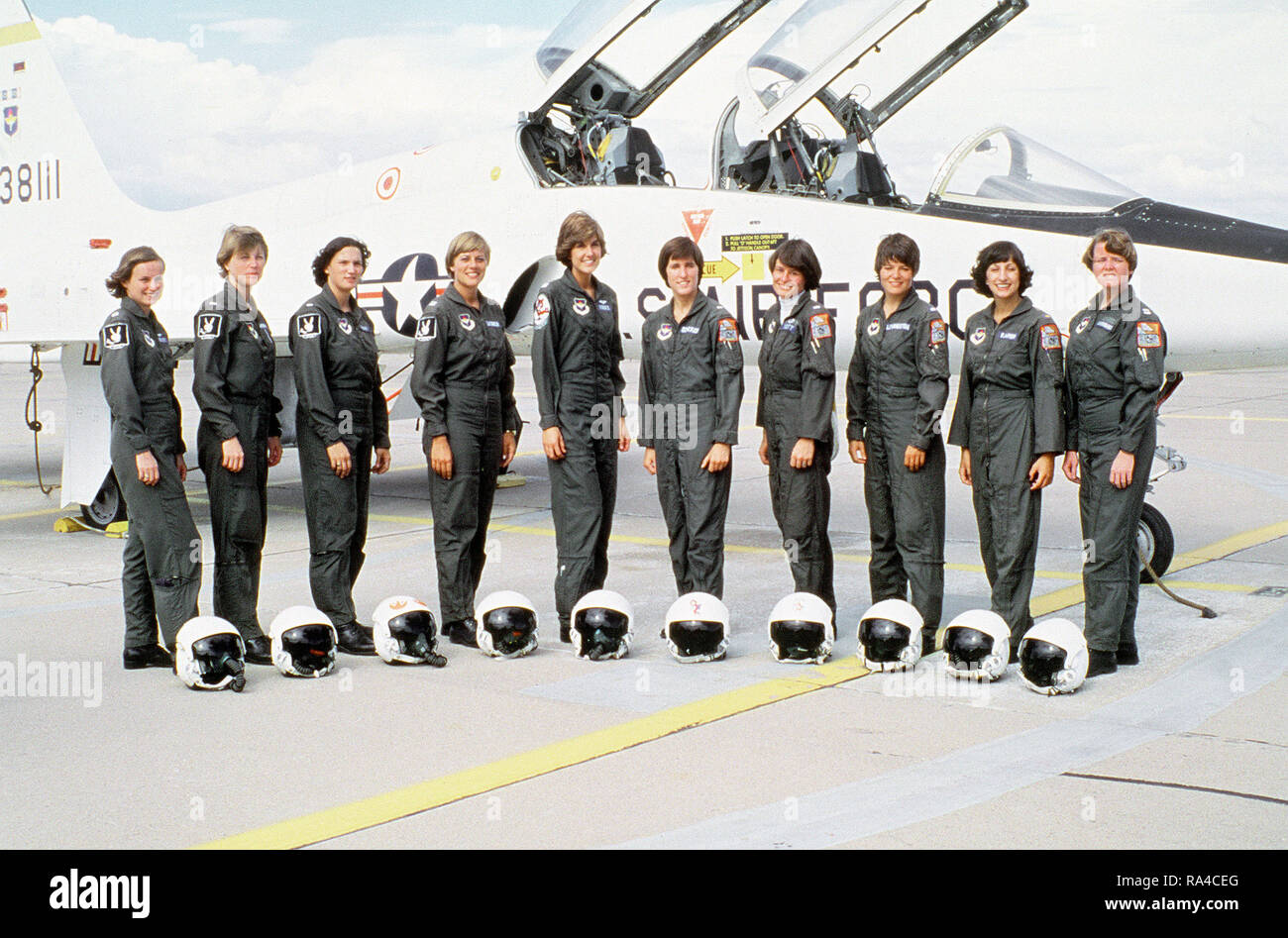 1977 - The first 10 female officers to graduate from the Air Force Undergraduate Pilot Training Program pose for a group photo in front of a T-38 training aircraft. Stock Photo