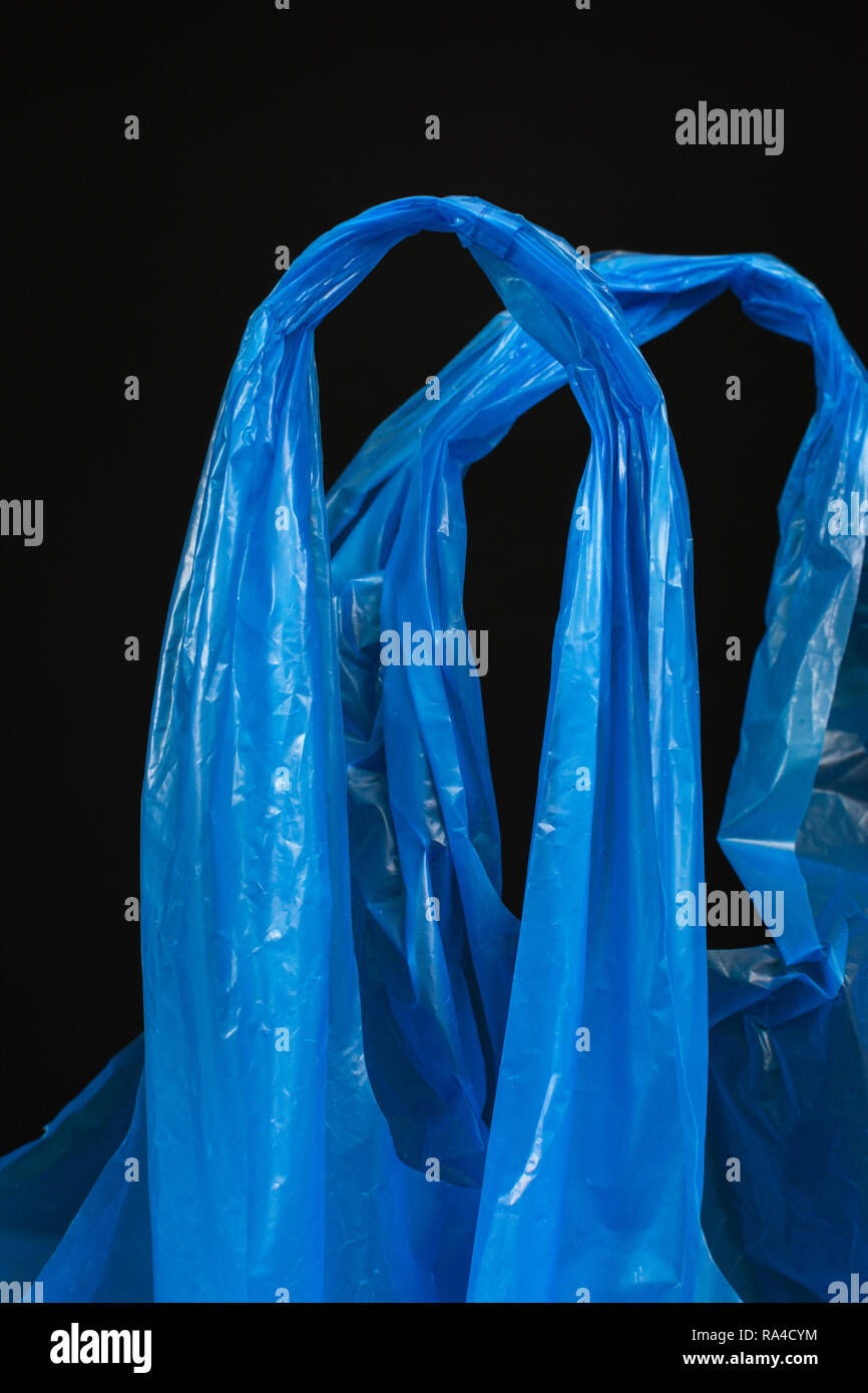 Plastic bag. Generic blue plastic shopping bag / carrier bag. Metaphor