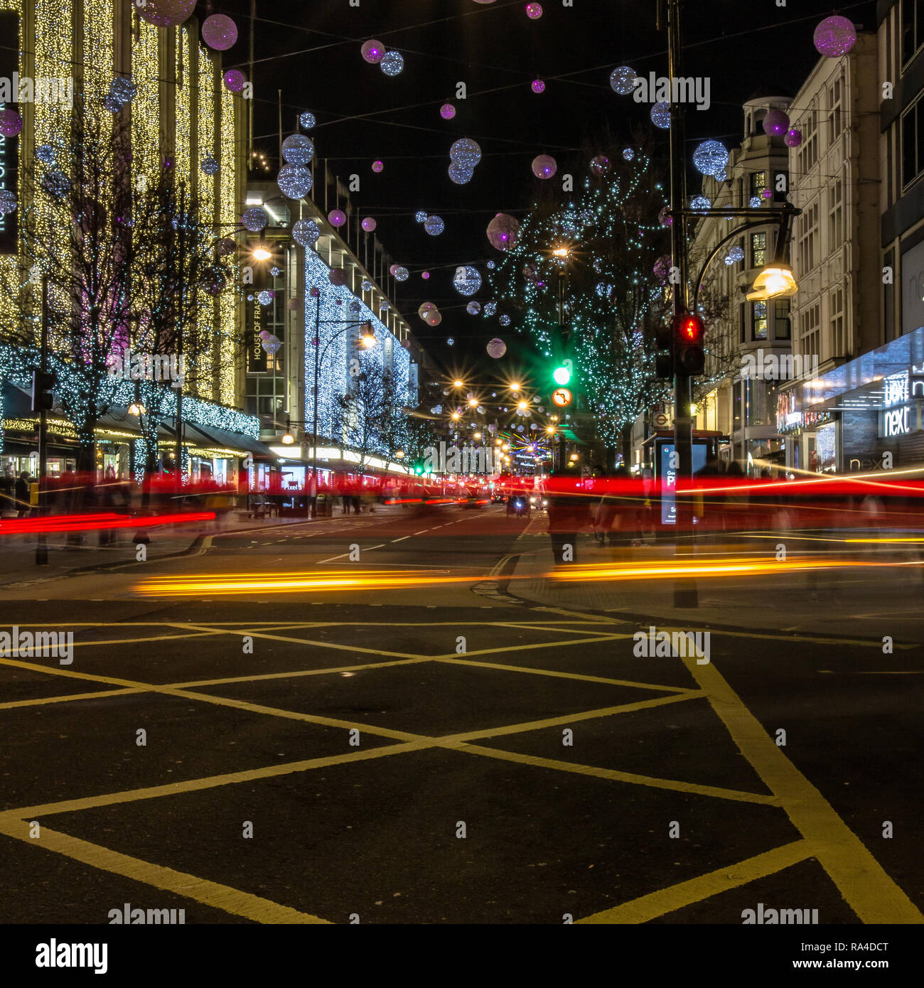 Oxford Street Christmas lights with yellow box junction in London, taken at dusk, early evening