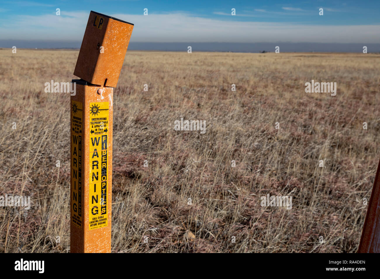 Denver, Colorado - A marker shows where an underground fiber optic cable runs through Rocky Flats National Wildlife Refuge,. Stock Photo