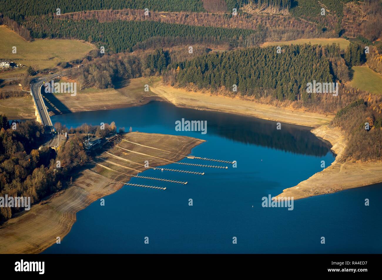 Aerial view, wide dry embankment, boat jetties, water shortage, Biggesee, Biggetalsperre, reservoir, Olpe, Sauerland Stock Photo