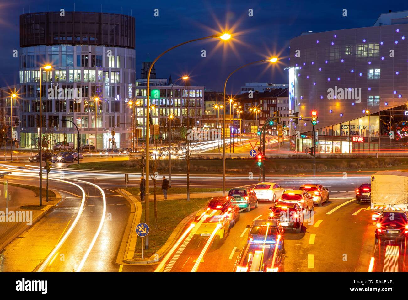 Evening city traffic in Essen, Germany, large intersection, roundabout, Berliner Platz, Berlin Square, this area would also be Stock Photo