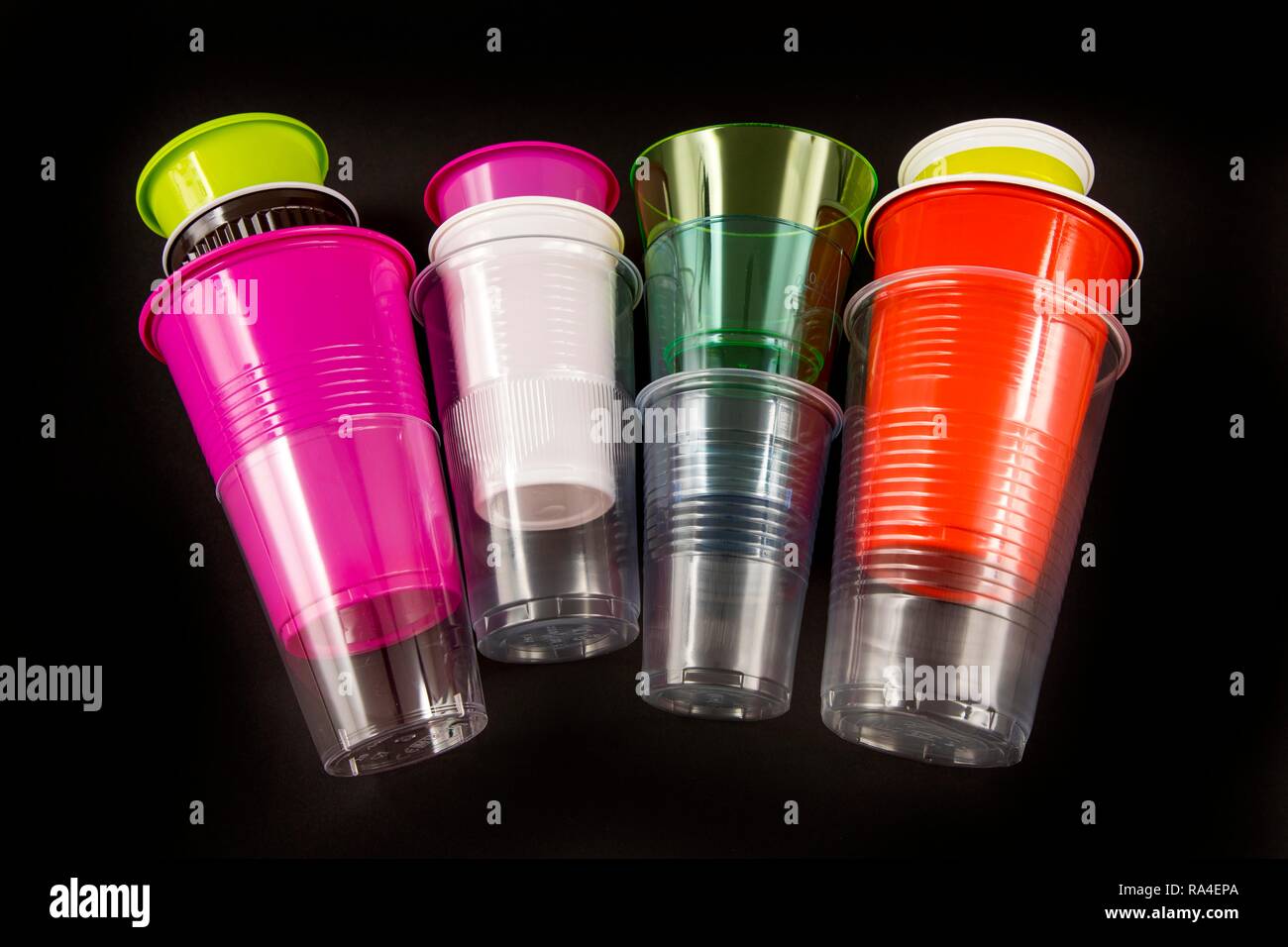 Plastic cups, many different types, shapes, colors, disposable cups, plastic waste Stock Photo