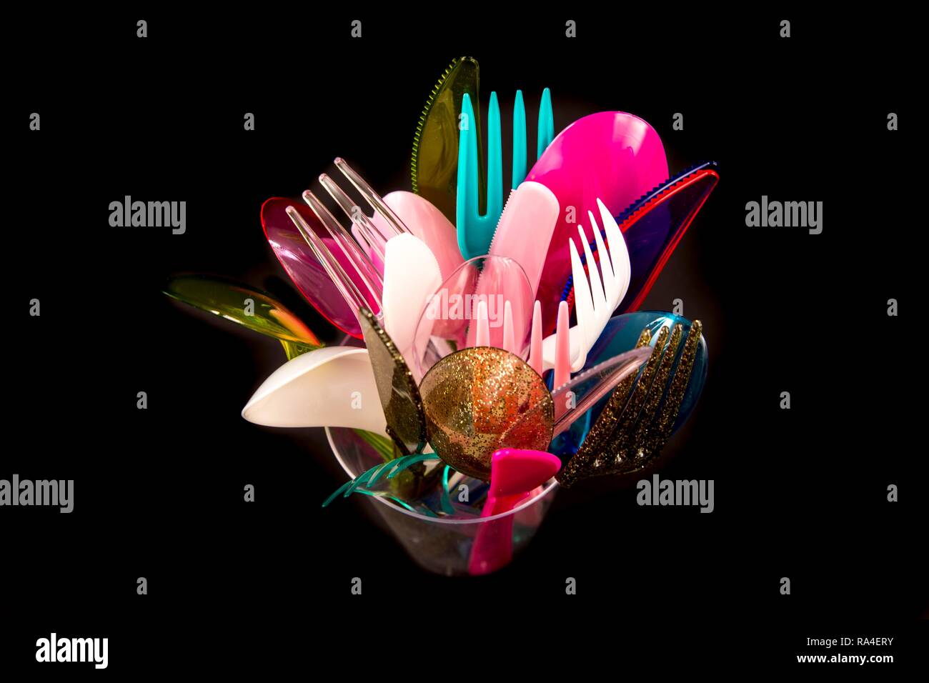 Plastic cutlery, disposable cutlery, knives, forks, spoons, plastic waste, various colours, types Stock Photo