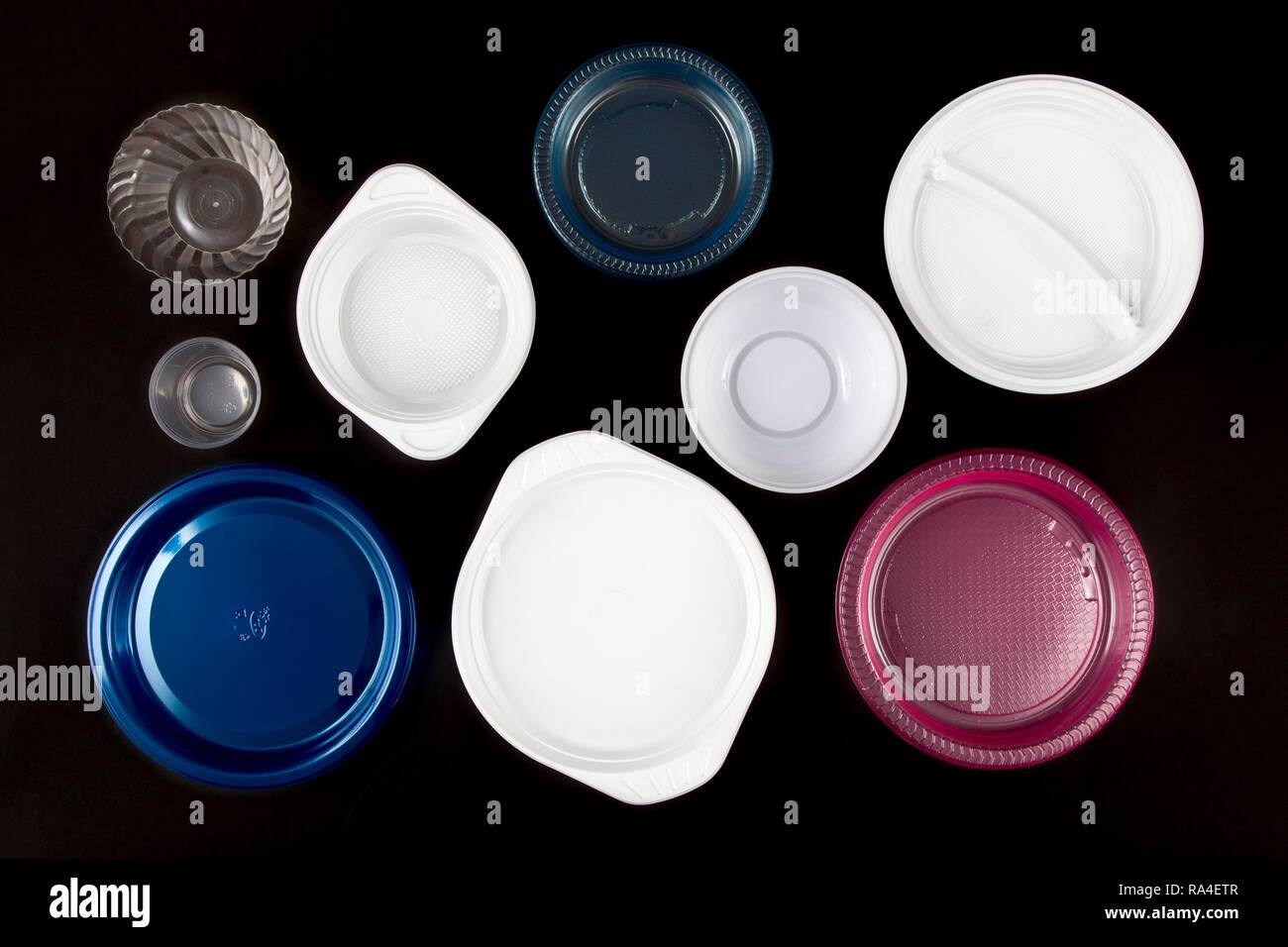 Plastic plates, plastic crockery, disposable crockery, plastic waste, various shapes and colors Stock Photo