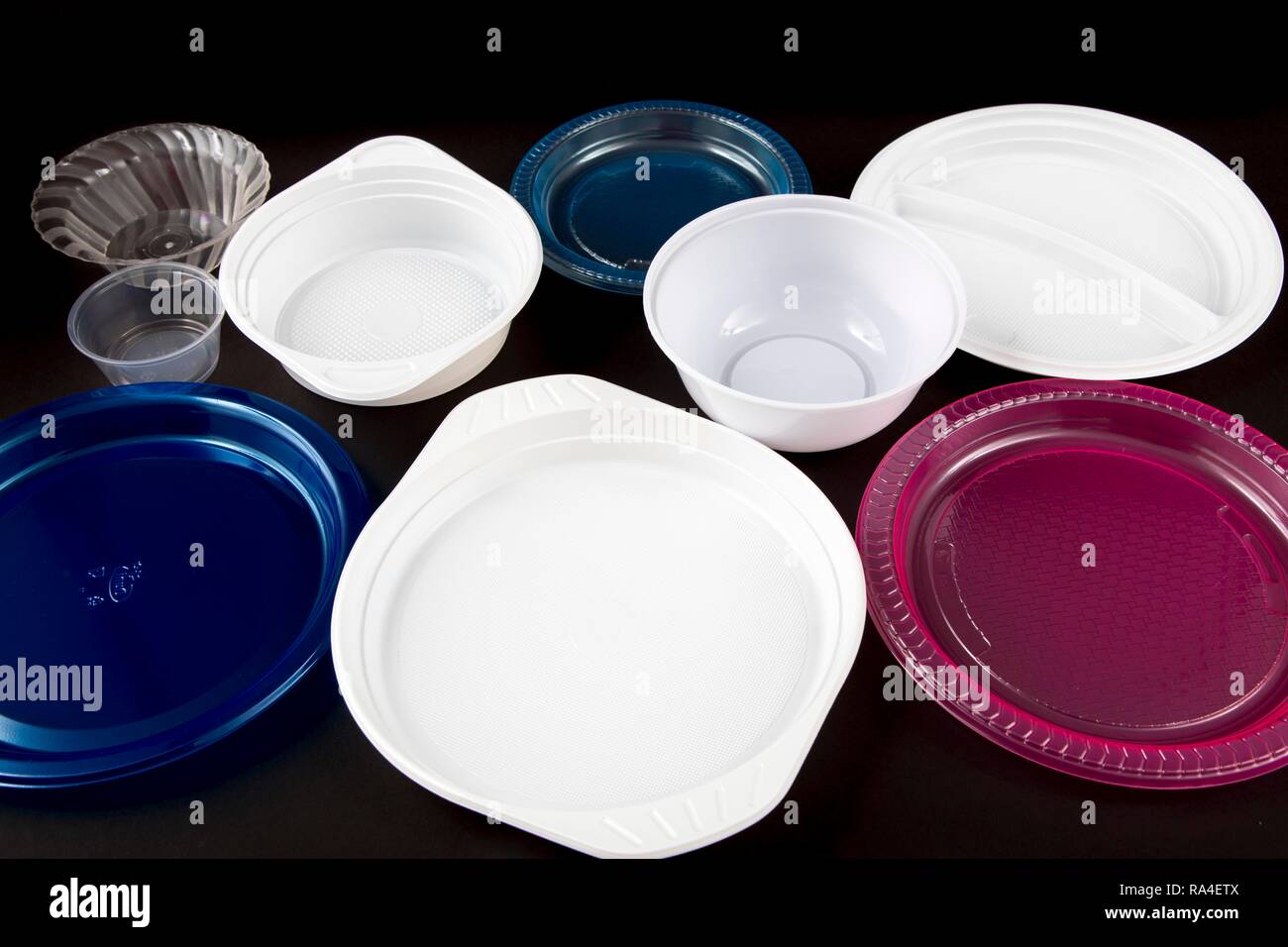 Plastic plates, plastic crockery, disposable crockery, plastic waste, various shapes and colors Stock Photo