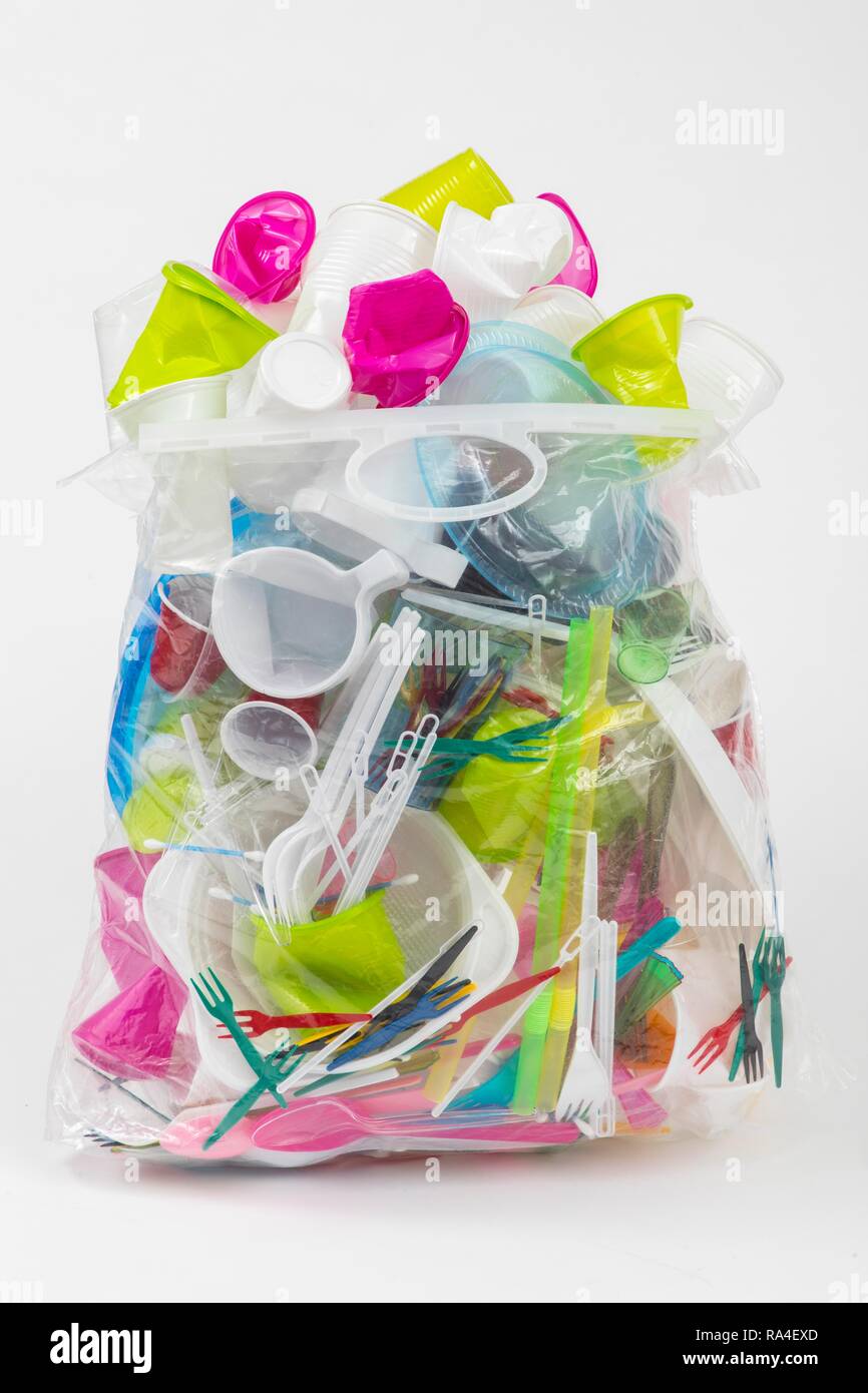 Garbage bag filled with disposable crockery, plastic cutlery, plastic