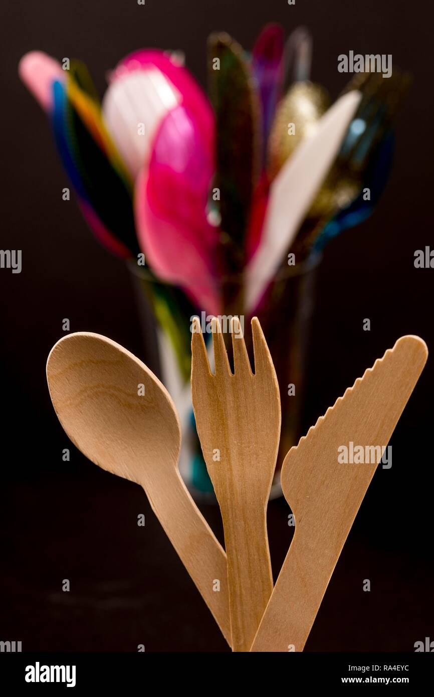Disposable wooden cutlery, recyclable, plastic cutlery, disposable cutlery, knives, forks, spoons, plastic waste Stock Photo