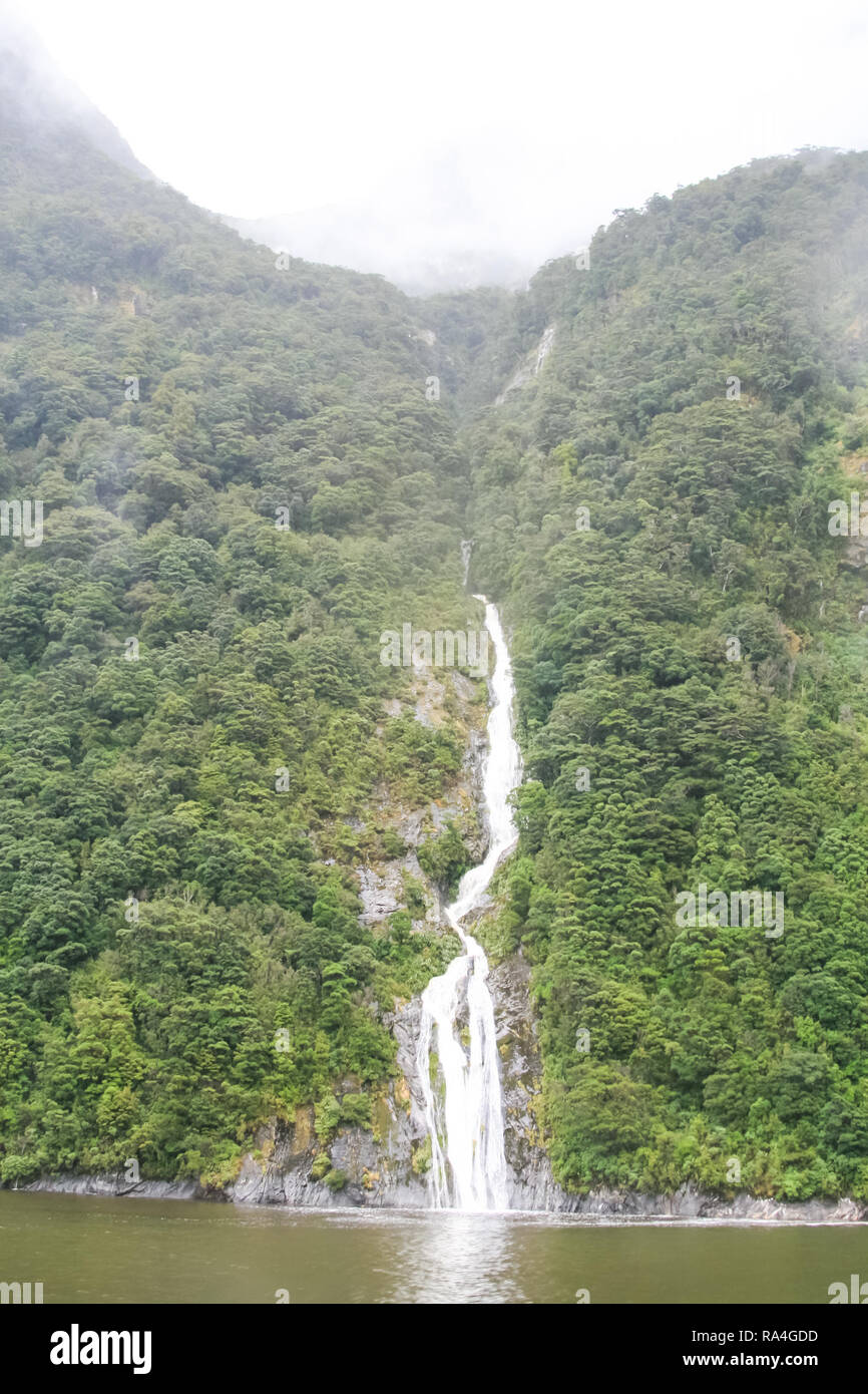 Waterfall on a mountain river. Landscapes of New Zealand Stock Photo ...