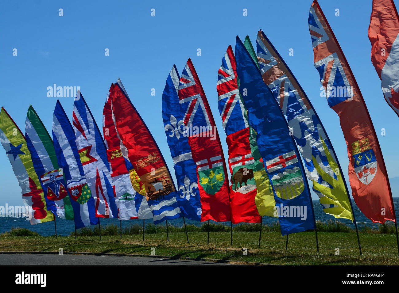 Canadian provincial banners blowing in the wind. Stock Photo