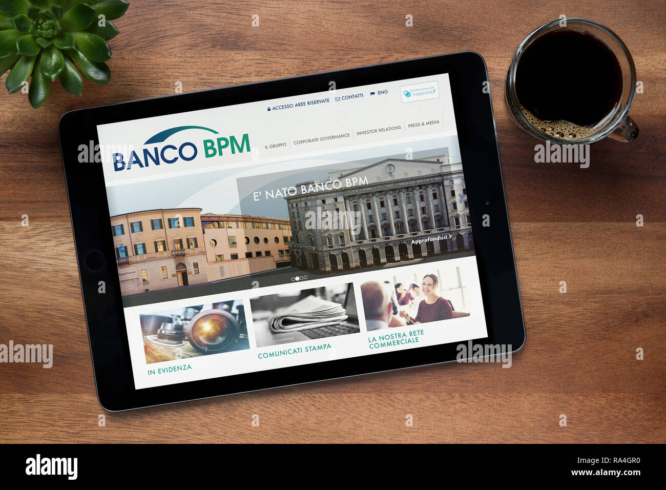 The website of Banco BPM Società per Azioni is seen on an iPad tablet, on a wooden table (Editorial use only). Stock Photo