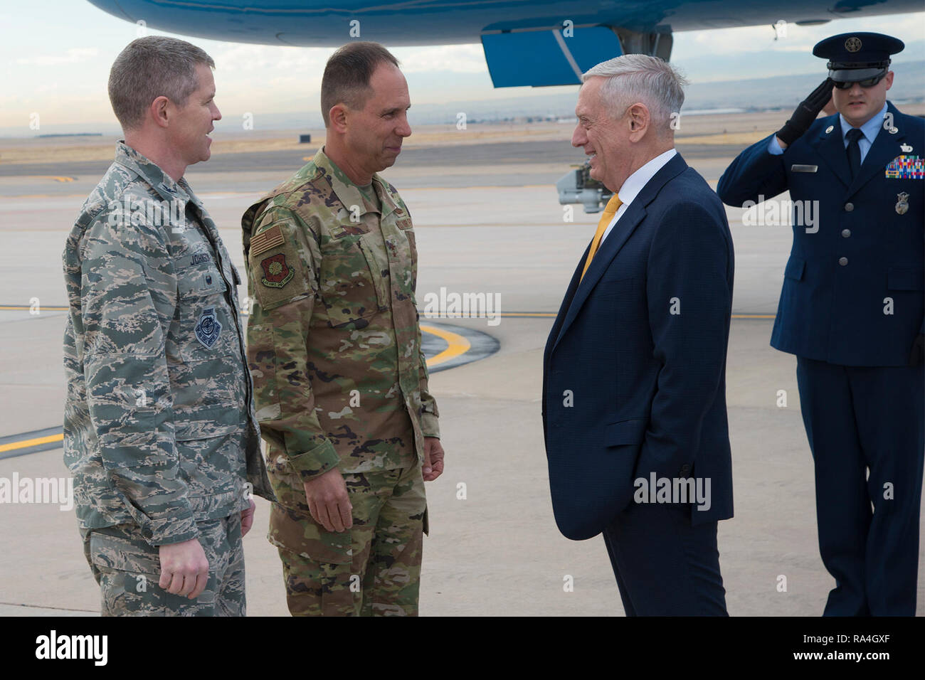 PETERSON AIR FORCE BASE, Colo. – (From left to right) Col. Sam Johnson, 21st Space Wing vice commander, and Maj. Gen. John Shaw, Air Force Space Command deputy commander, greet Defense Secretary James Mattis on the flight line at Peterson Air Force Base, Colo., Nov. 30, 2018. Mattis was in Colorado Springs to meet with senior cadets at the U.S. Air Force Academy. (U.S. Air Force photo by Robb Lingley) Stock Photo