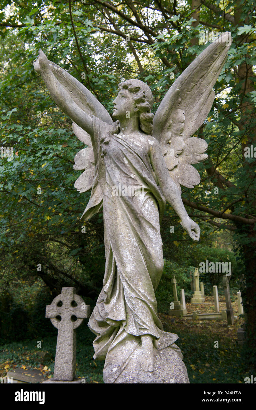 Statue angel in graveyard East Highgate cemetery London England Stock Photo