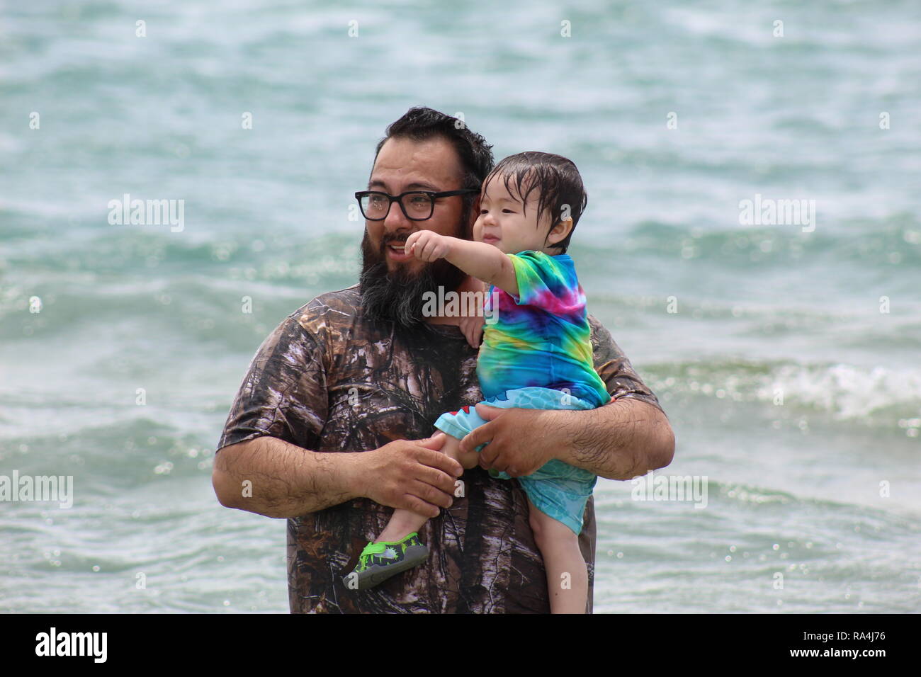 5th of August, 2018, Father and son enjoying their time looking at the view around Canyon Lake, Canyon Lake, TX, USA: Credit: Bianca Martinez Stock Photo
