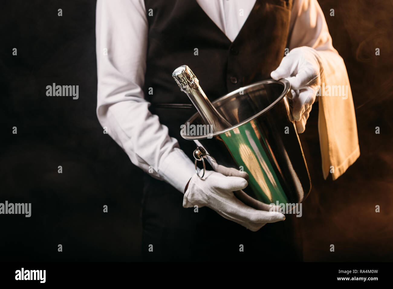 Waiter holding bottle hi-res stock photography and images - Alamy
