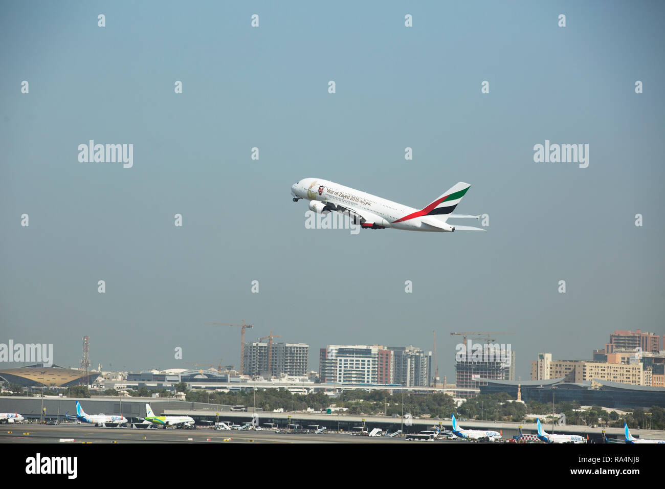 Emirates flight takeoff from Dubai Stock Photo