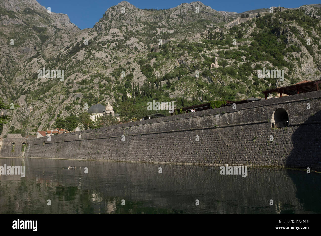Fortifications protected the medieval town of in Kotor Montenegro in ancient time sna d remains a tourist attraction. Stock Photo