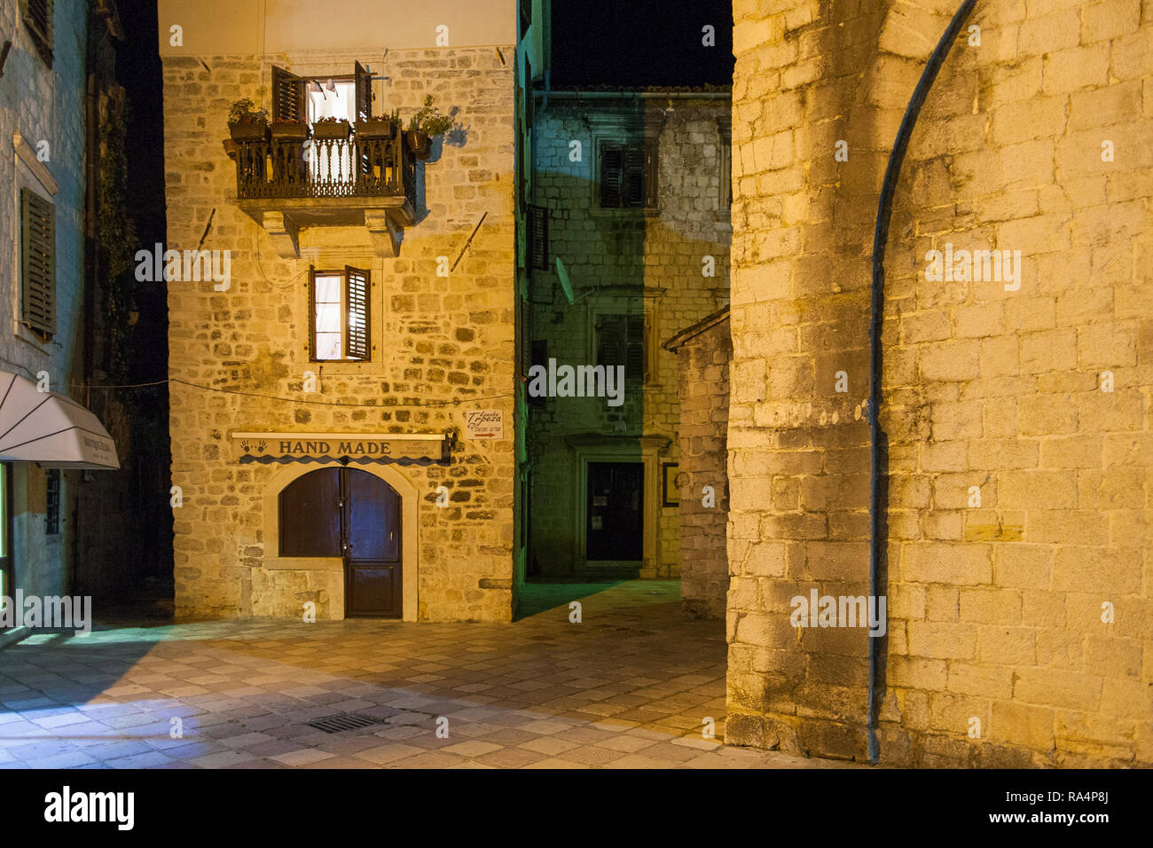 Night time casts shadows on the medieval architecture of the old town of Kotor, Montenegro. Stock Photo
