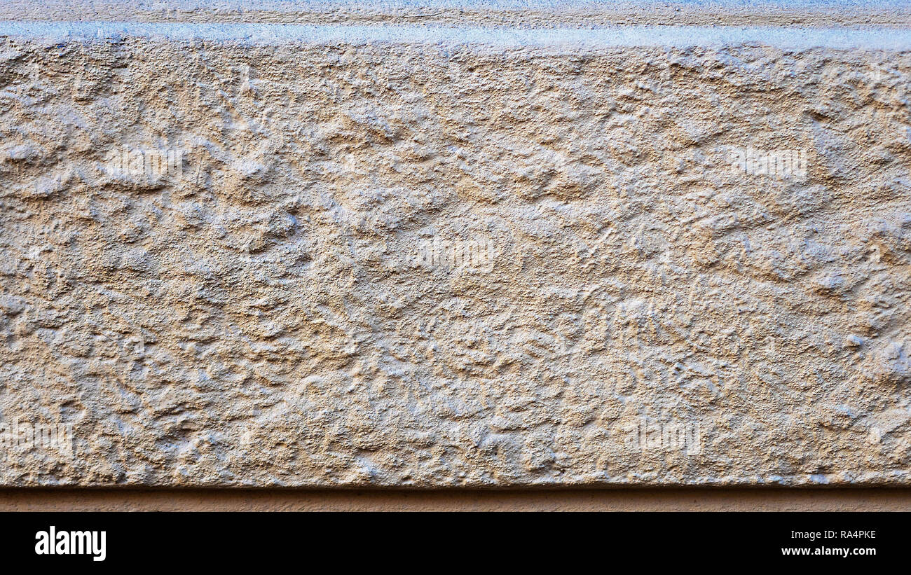 Close Up Photo Fragment Of Masonry Wall With Decorative Plaster