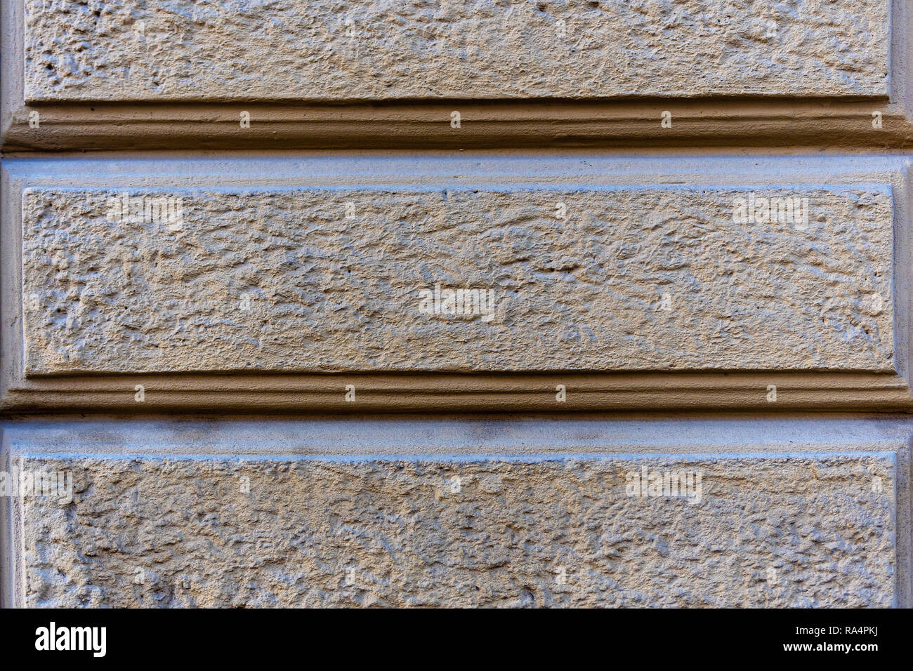 Close Up Photo Fragment Of Masonry Wall With Decorative Plaster