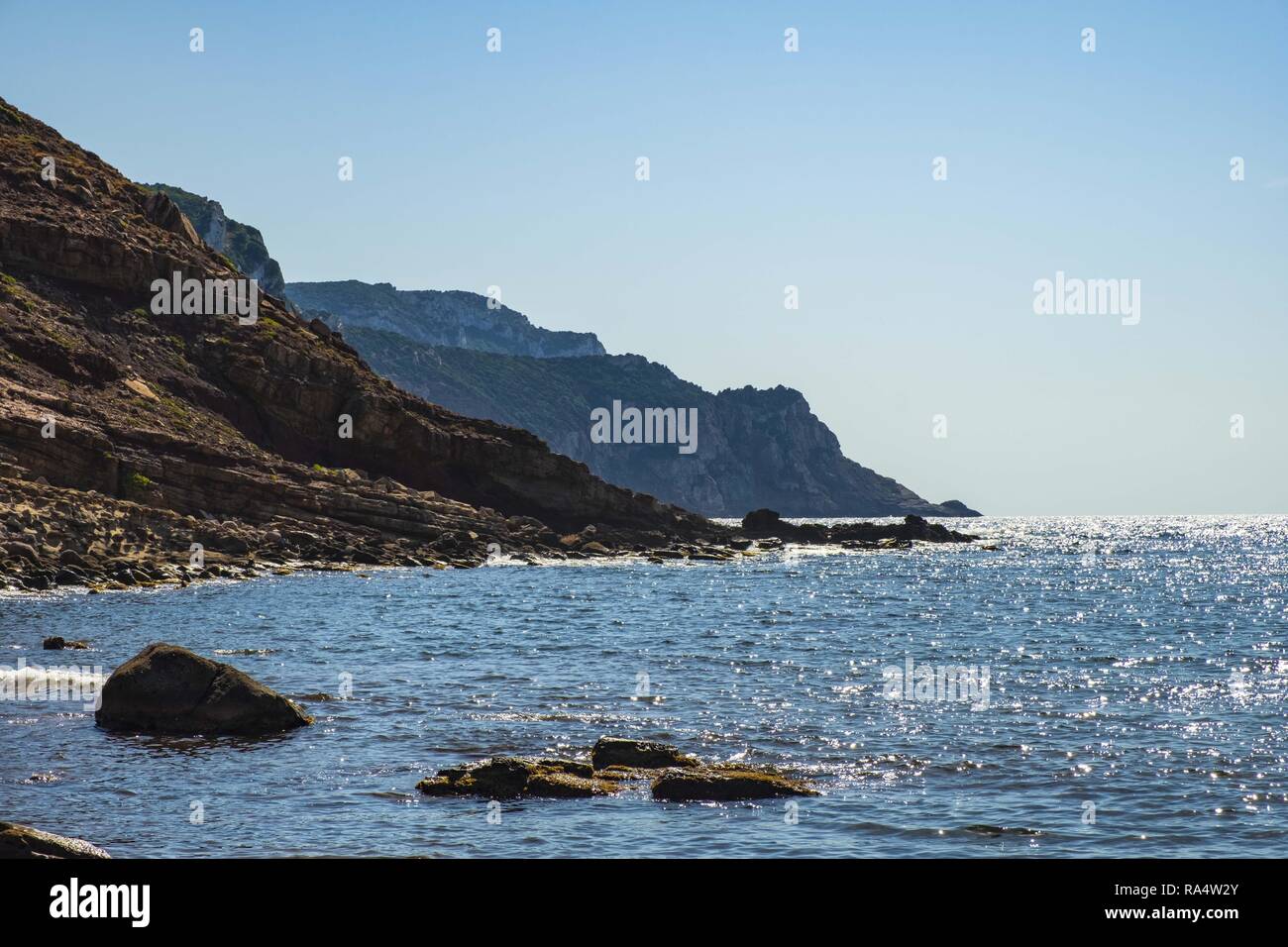 Alghero, Sardinia / Italy - 2018/08/11: Panoramic view of the Cala Porticciolo gulf with cliffs over the Cala Viola gulf in the Porto Conte Regional Park Stock Photo