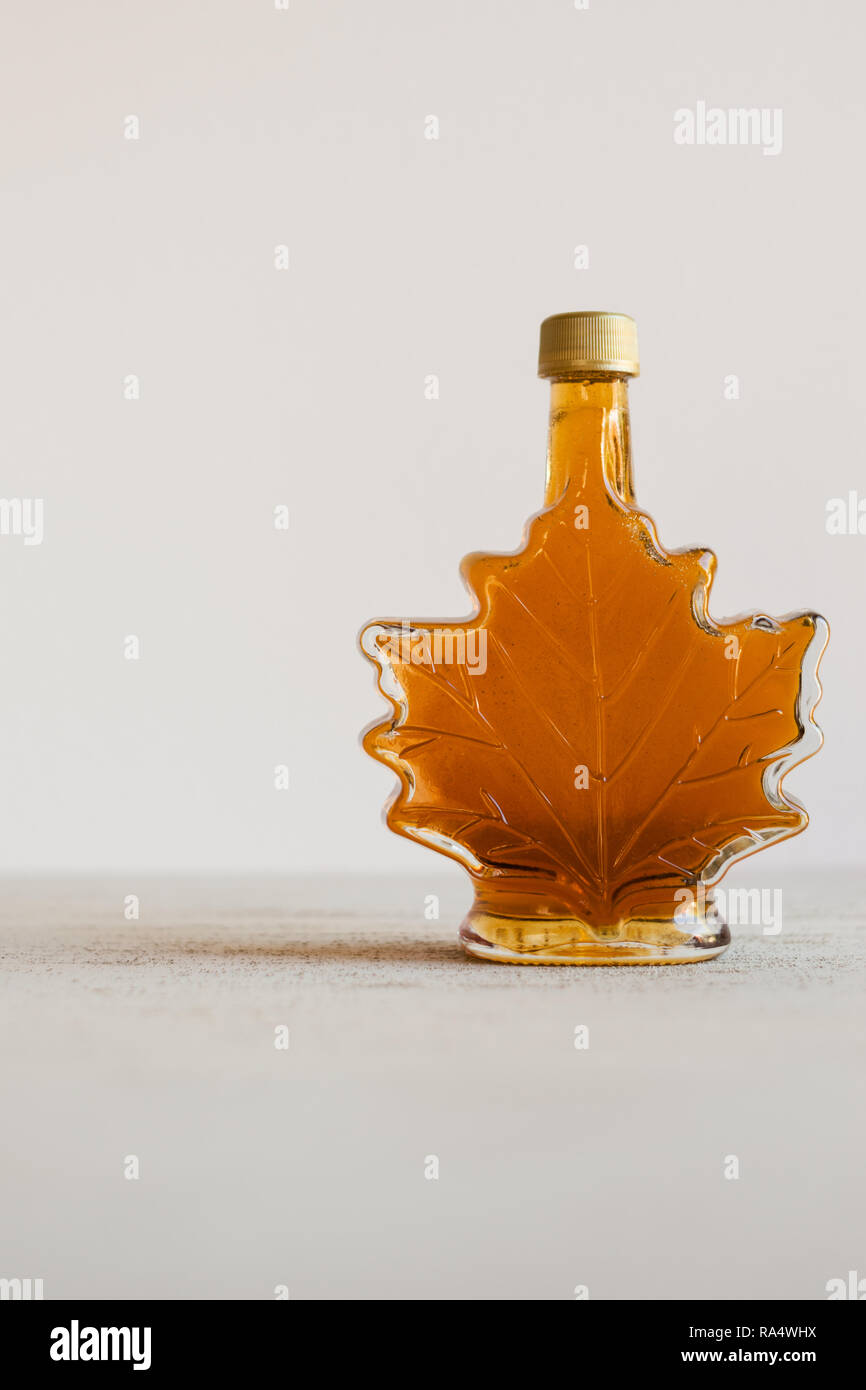 maple syrup in a leaf shaped bottle Stock Photo Alamy