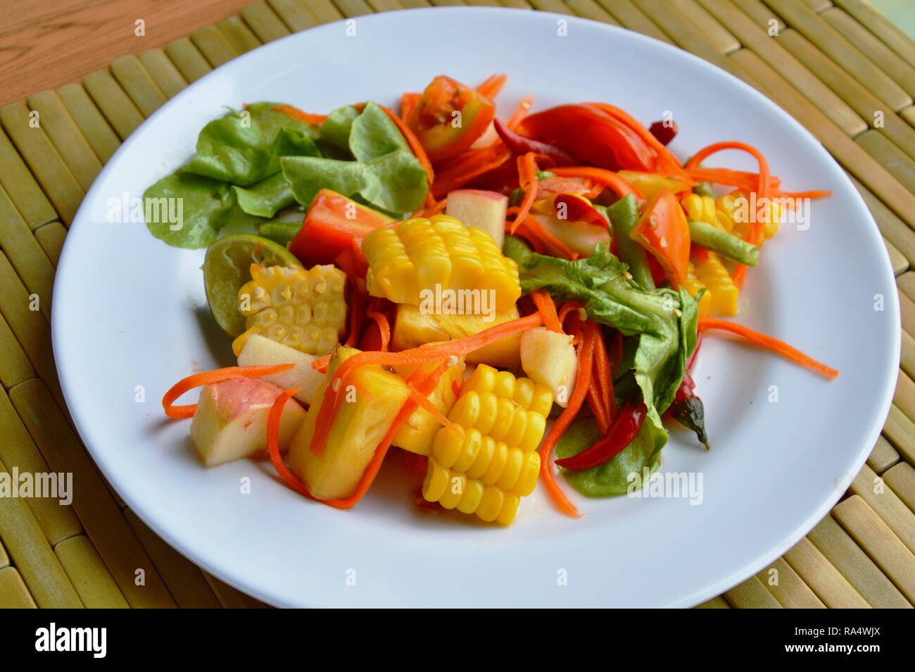 spicy mixed fruit and vegetable salad on dish Stock Photo Alamy