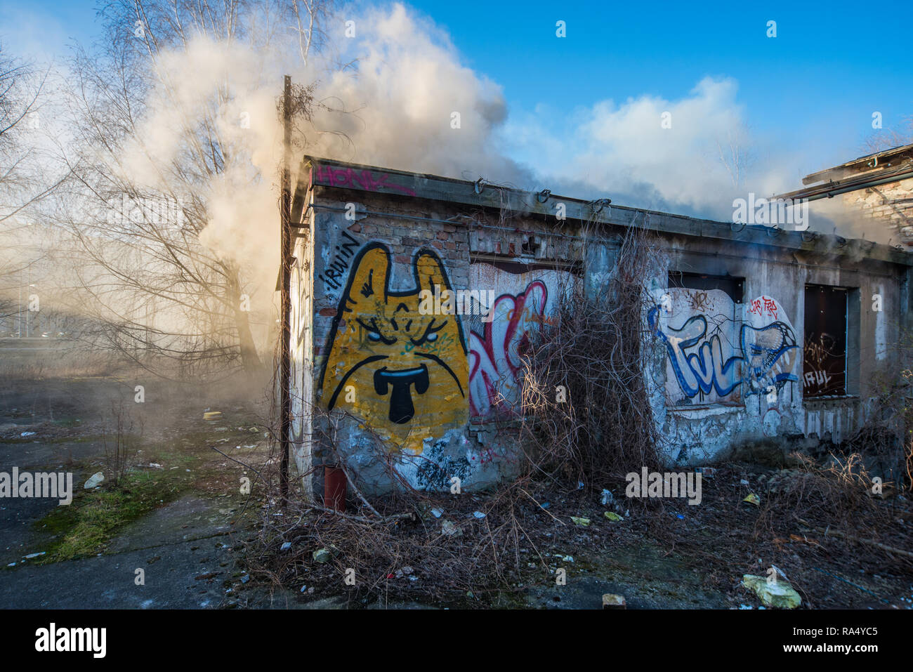 Graffiti on burning abandoned house Stock Photo Alamy