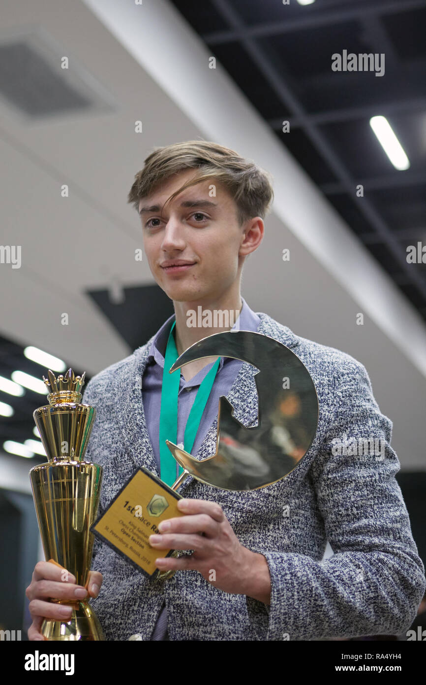 St. Petersburg, Russia - December 30, 2018: Grandmaster Daniil Dubov, Russia holding the golden cup of World Rapid Chess Championship 2018 after award Stock Photo