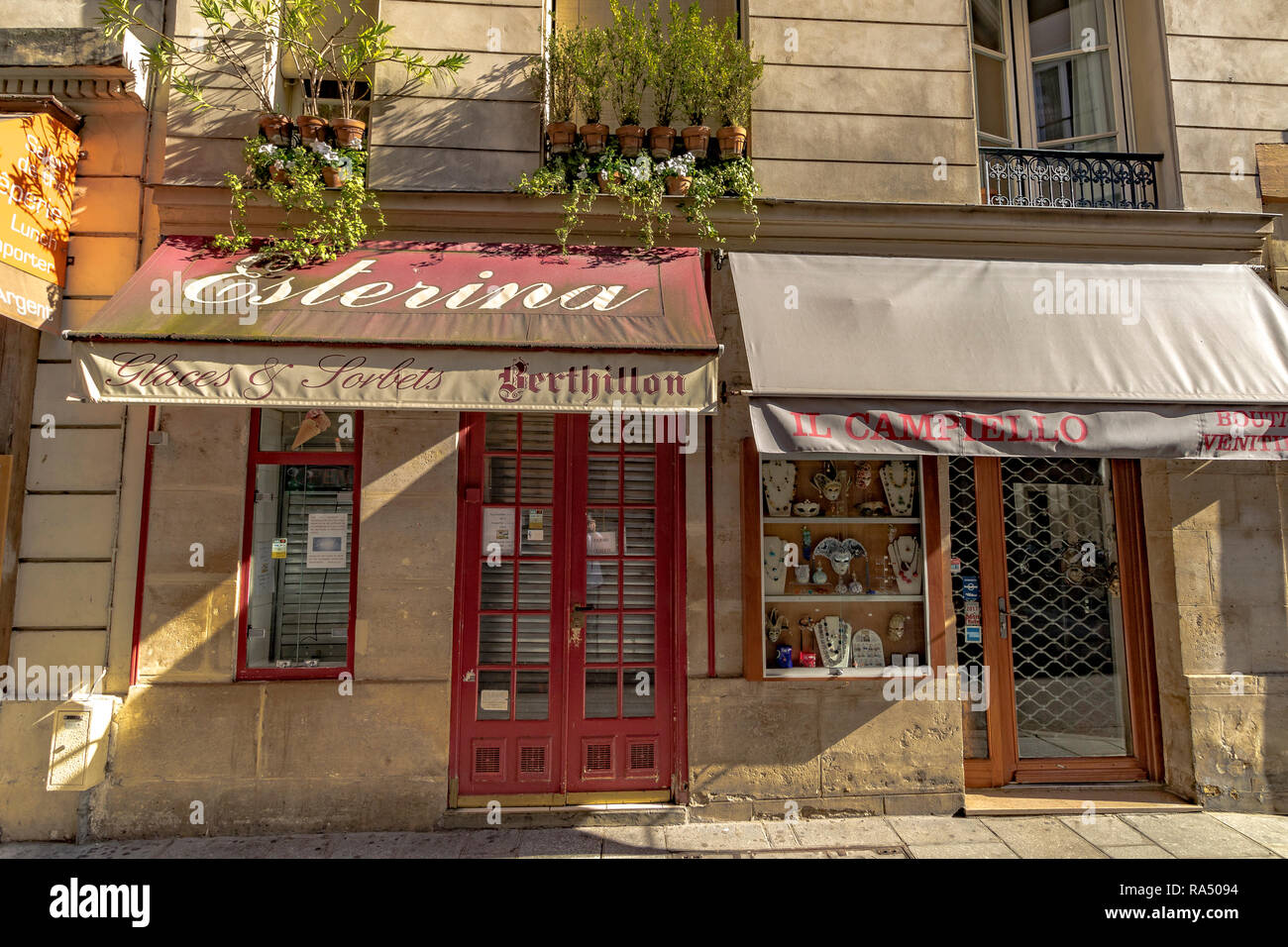Esterina glaces and sorbet shop and Il Campiello a decorative mask shop on  Rue Saint-Louis en l'Île ,Île Saint-Louis,Paris Stock Photo