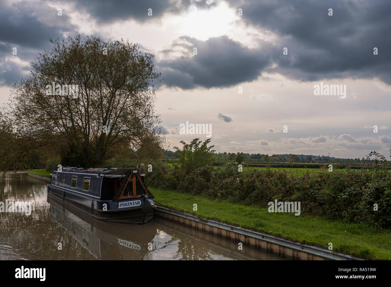 Stormclouds over the Grand Union Canal (Oxford Canal Section) near Lower Shuckburgh, Warwickshire, England, UK: moored narrowboat (WOP) Stock Photo