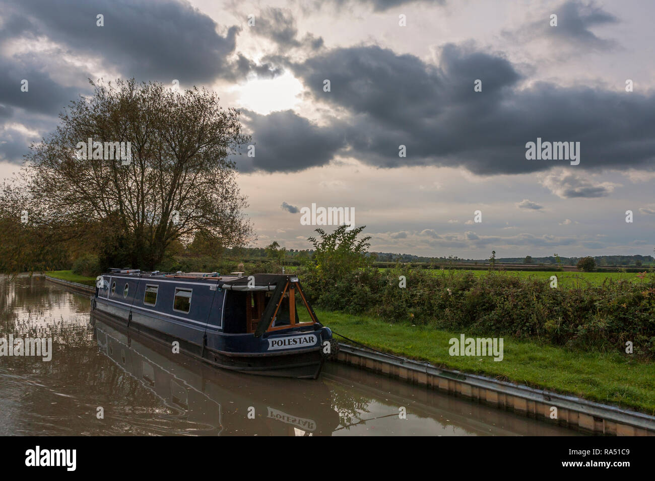 Stormclouds over the Grand Union Canal (Oxford Canal Section) near Lower Shuckburgh, Warwickshire, England, UK: moored narrowboat (WOP) Stock Photo