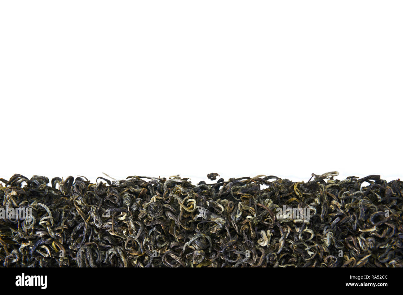 A pile of dry green tea. Isolated on white background. Stock Photo