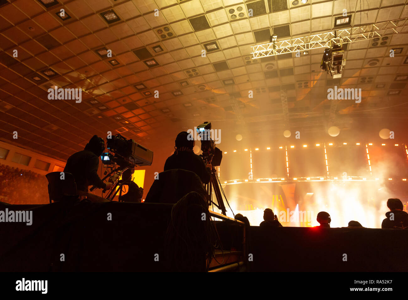 A group of cameramen working during the concert. Stock Photo