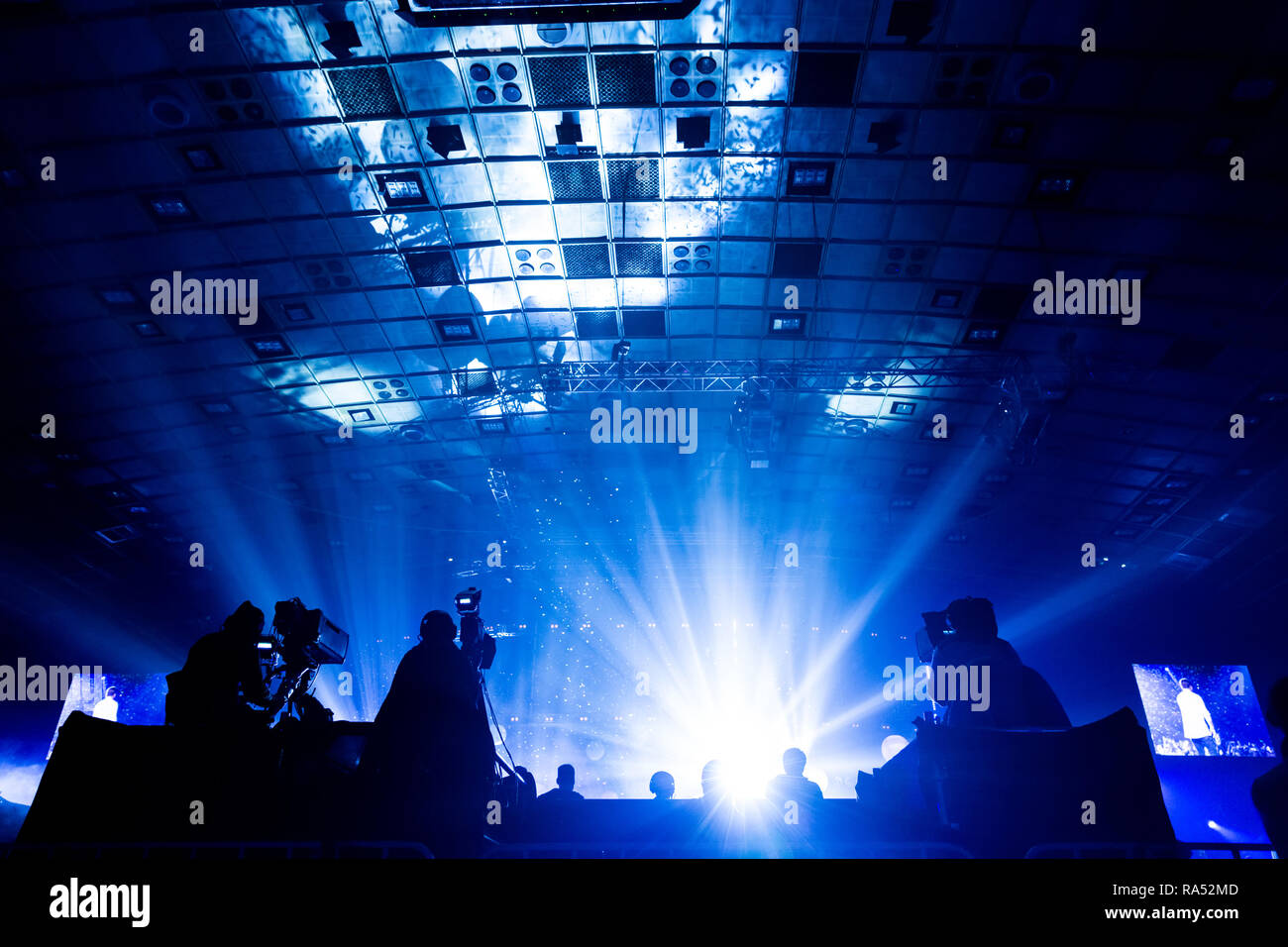 A group of cameramen working during the concert. Stock Photo
