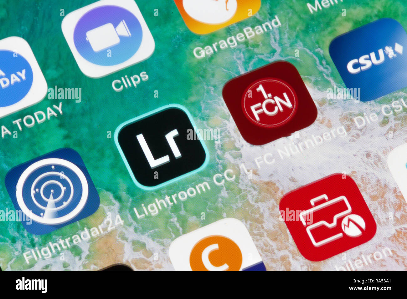 Nuremberg, Germany - December 29, 2018: A close-up photo of Apple iPhone screen with icons Lightroom CC, 1. FC Nürnberg, CSU and other apps. Stock Photo