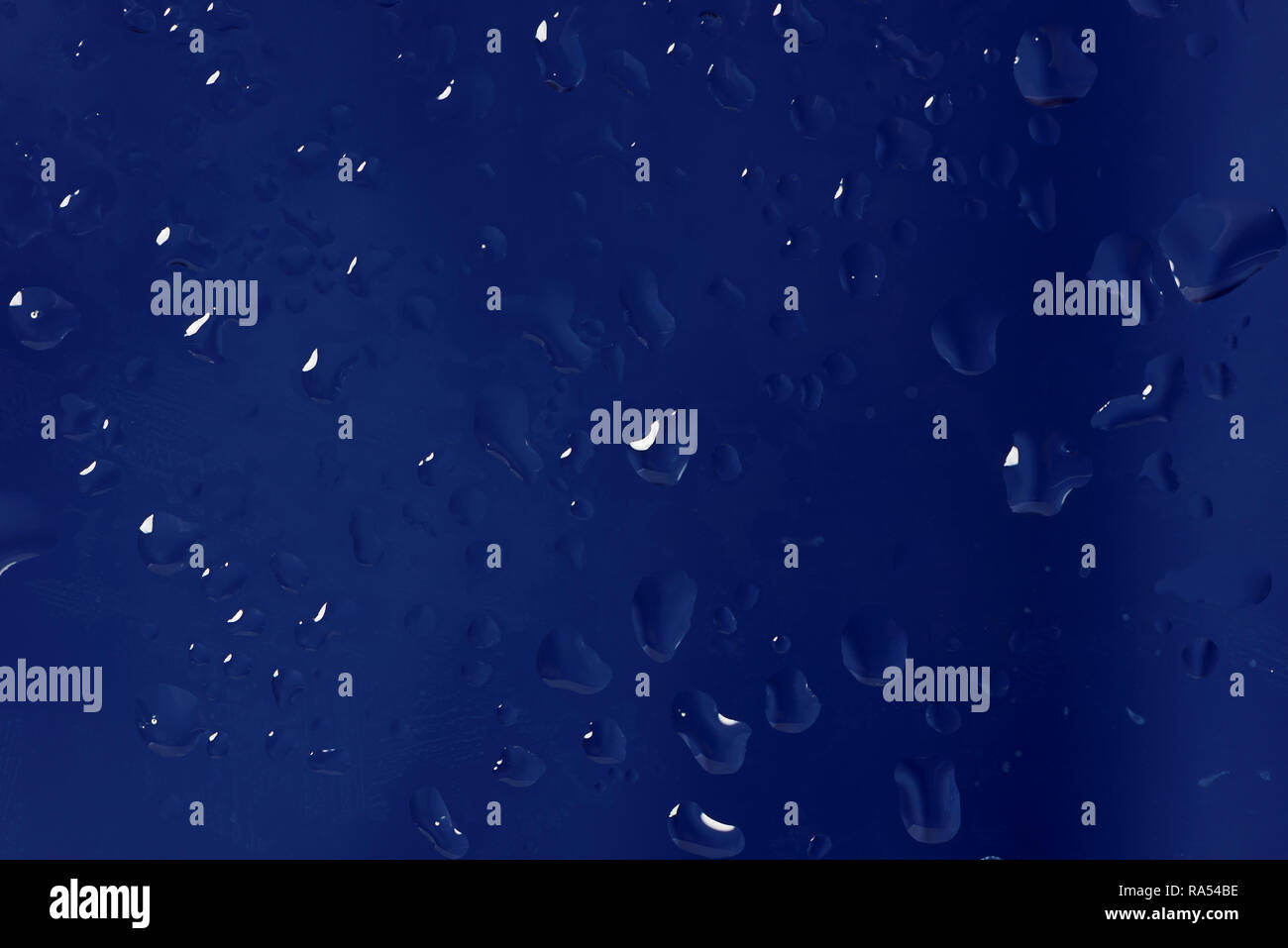 Blue abstract background made drops of water on a glass Stock Photo - Alamy