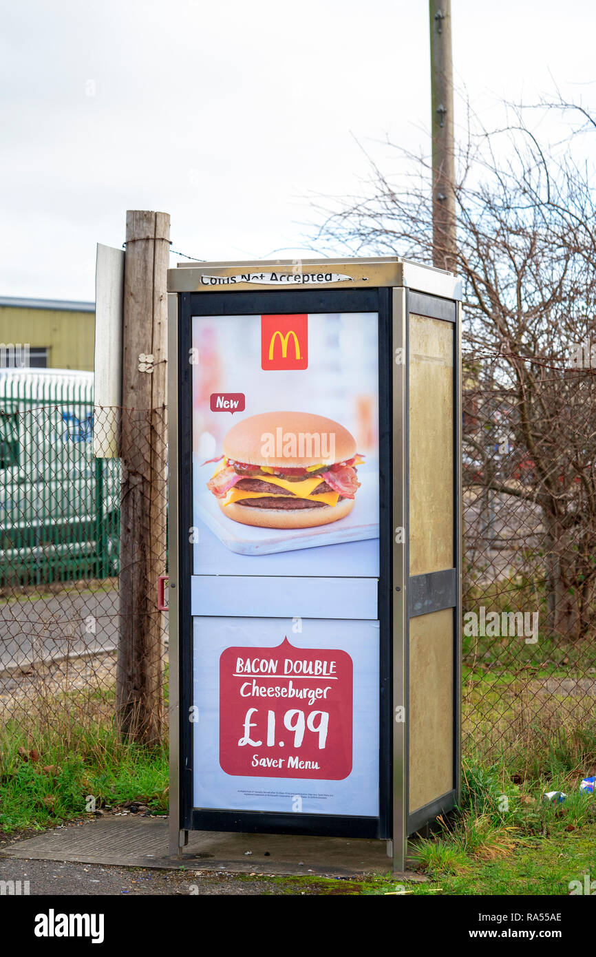 McDonalds restaurant advert on public telephone kiosk UK Stock Photo