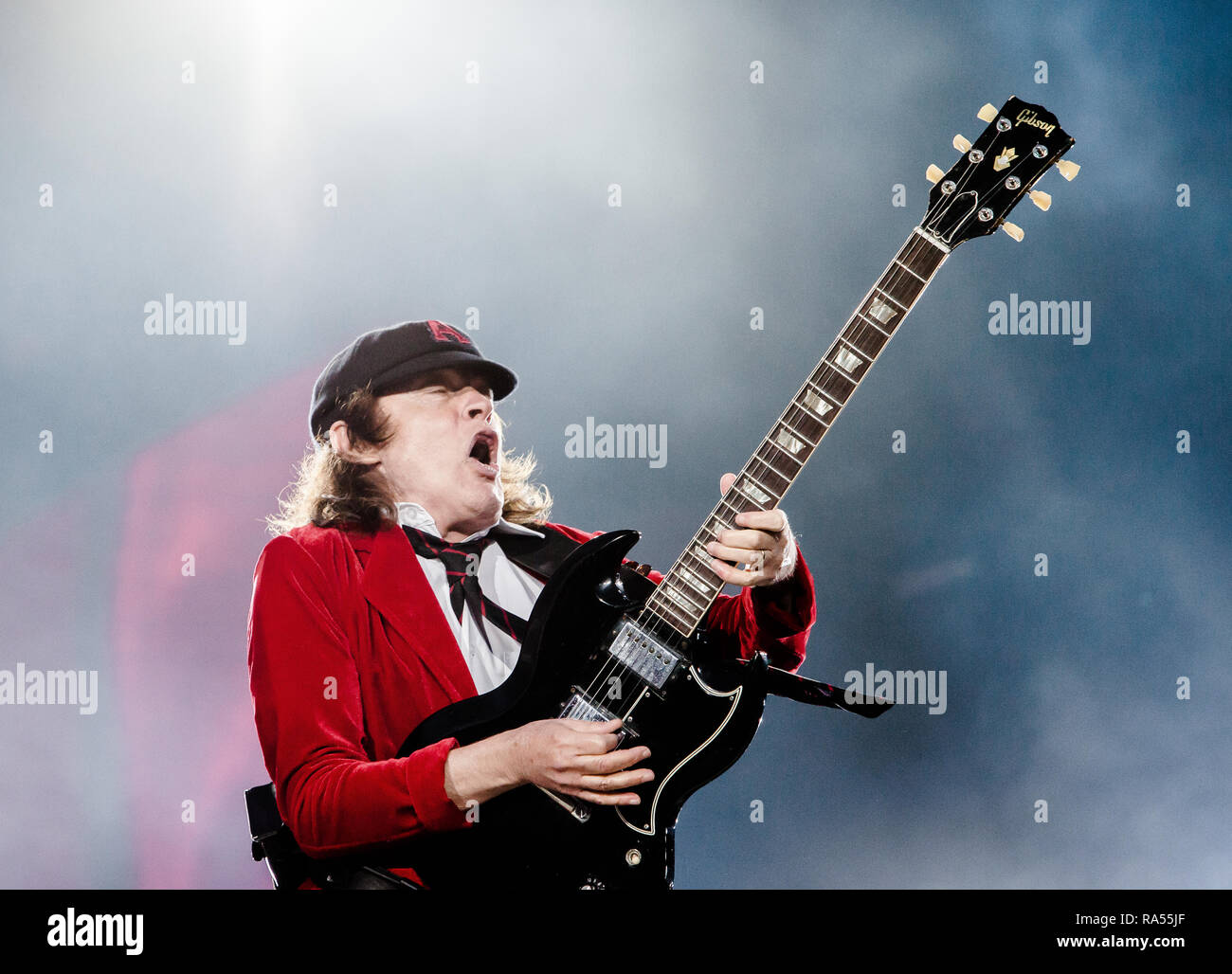 The Australian rock band AC/DC performs a live concert at Dyreskuepladsen in Roskilde as part of the Rock or Bust World 2015 Tour. Here musician and guitarist Angus Young is seen live on stage. Denmark, 15/07 2015. EXCLUDING DENMARK Stock Photo