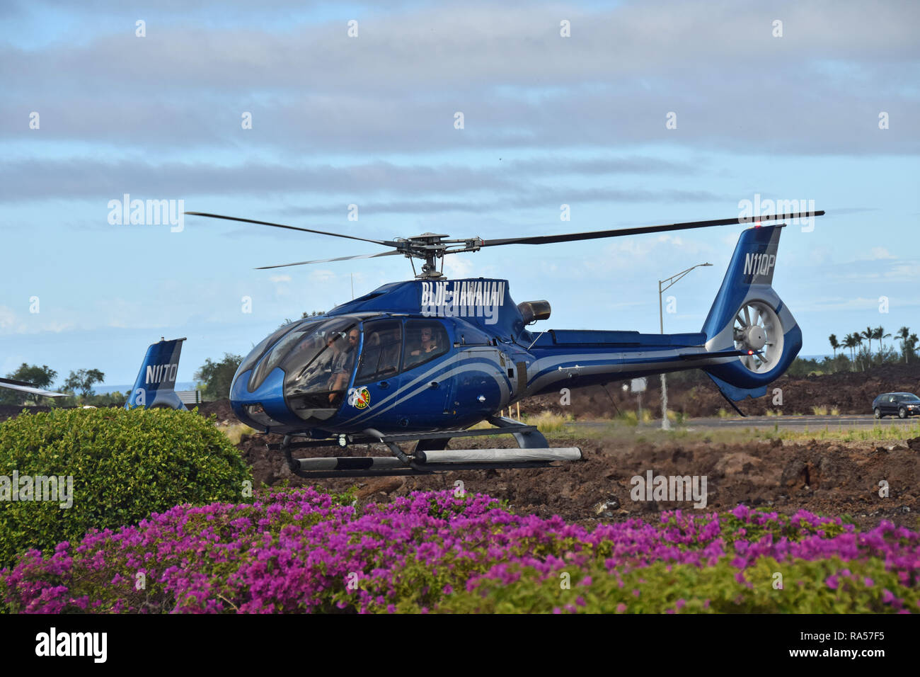 Kona, Hawaii - March 22, 2018: Blue Hawaiian Helicopter flies tourists on a scenic tour of the Big Island of Hawaii Stock Photo