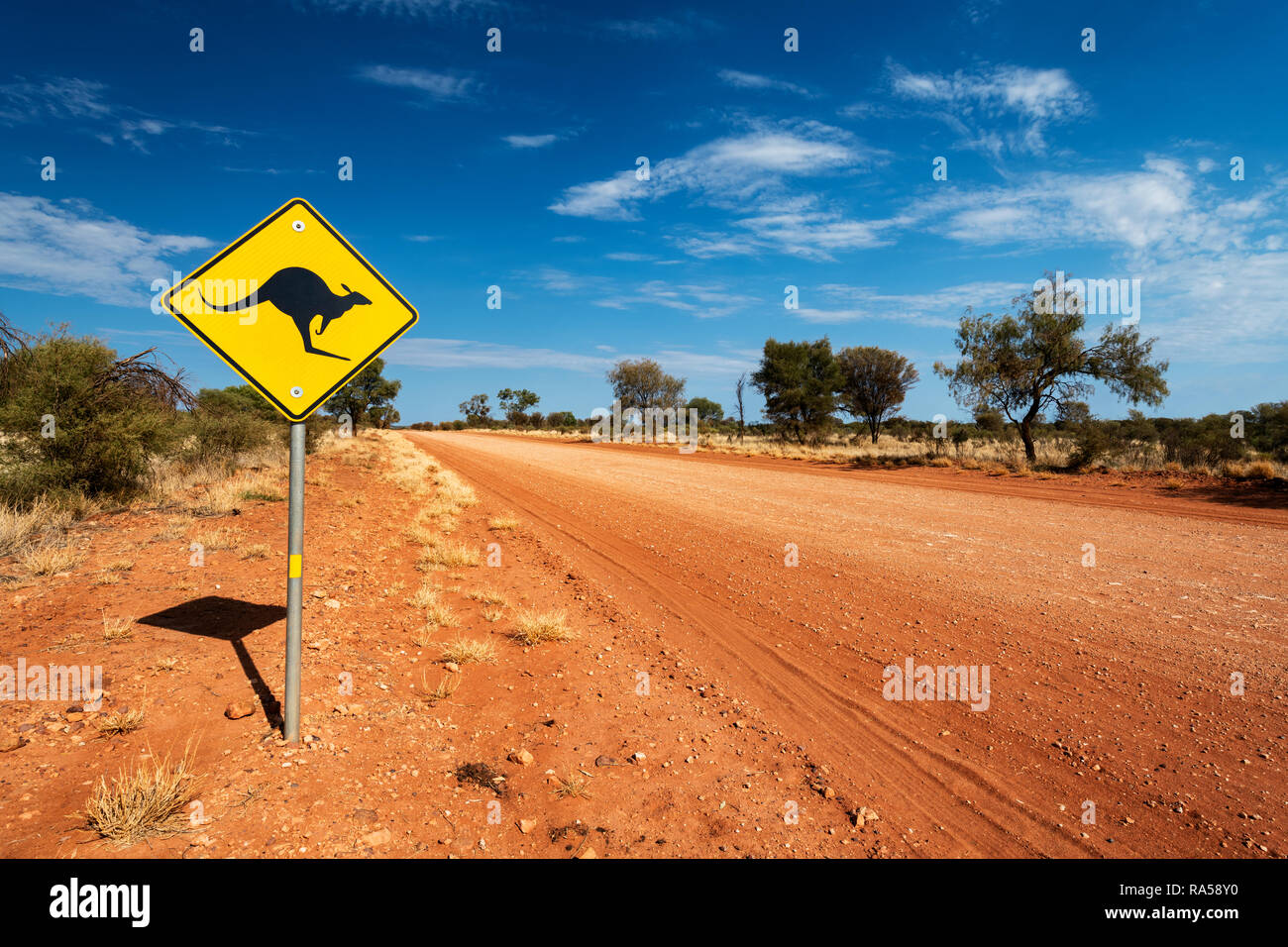 Sign at the remote Mereenie Loop Road in Central Australia. Stock Photo