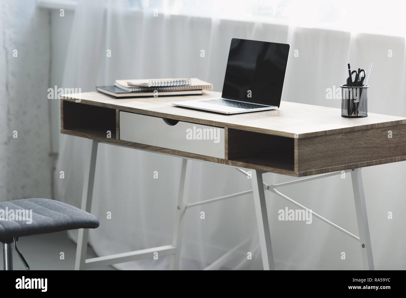 laptop with blank screen on wooden desk at workplace Stock Photo - Alamy