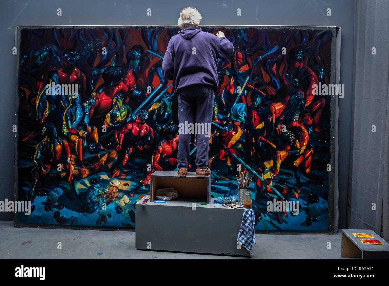 Artist Gerardo Trotti, 65, at work with his latest large scale series in his Madrid studio. Stock Photo