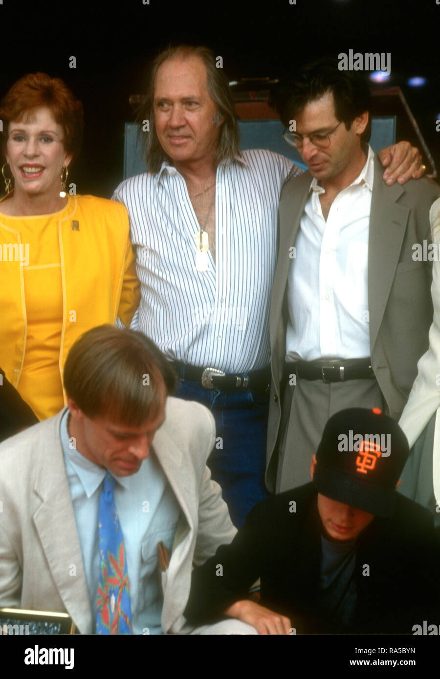 HOLLYWOOD, CA - JULY 15: Actress Carol Burnett, actor David Carradine, actor Robert Carradine, actor/honoree Keith Carradine and son Cade Carradine attend ceremony for his Star Ceremony on July 15, 1993 on Hollywood Walk of Fame in Hollywood, California. Photo by Barry King/Alamy Stock Photo Stock Photo