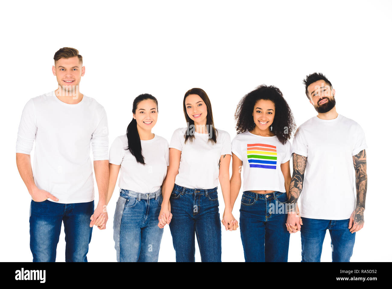 multiethnic group of young people holding hands isolated on white Stock ...