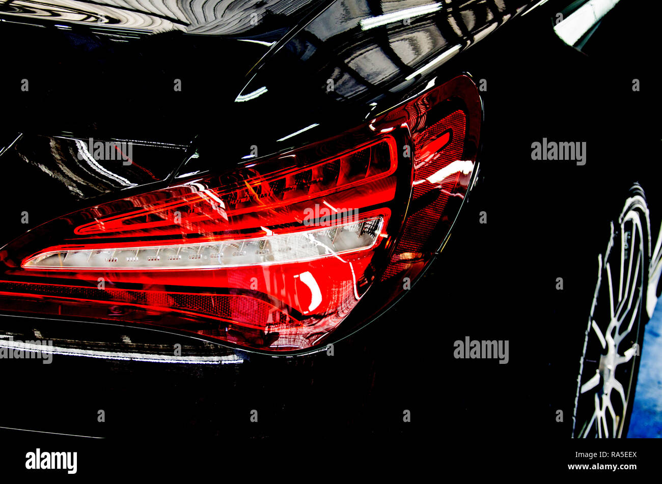 Closeup Luxury car tail light on a black car Stock Photo Alamy